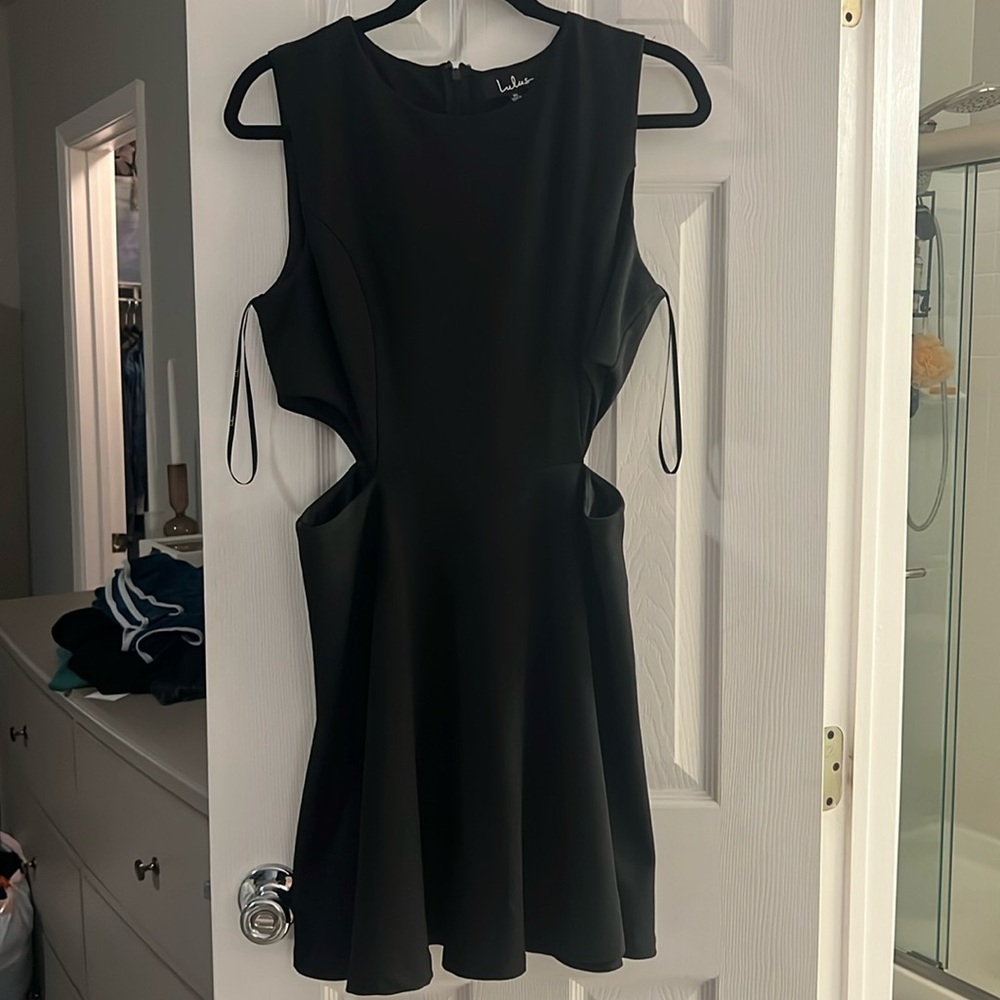 Peplum flair with cutout waist.